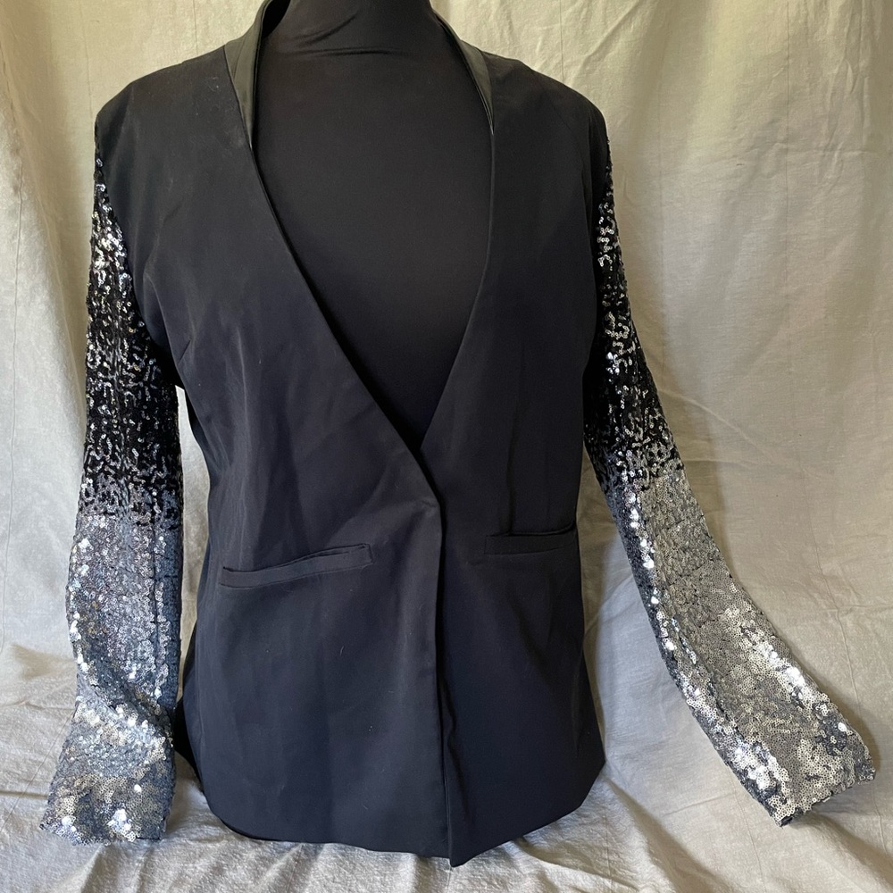 The Elton John jacket that didn’t fit. Small ‘XXL’!